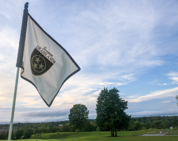 Foxland Golf and Country Club flag over golf course at sunset